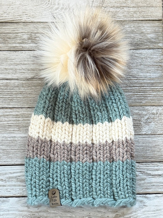 Succulent green, cream, and taupe striped knit beanie with a cream-and-brown faux-fur pom