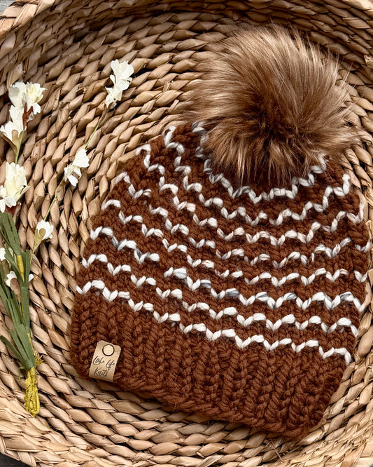 Hand-knit gingerbread brown and cream striped beanie with removable faux-fur pom